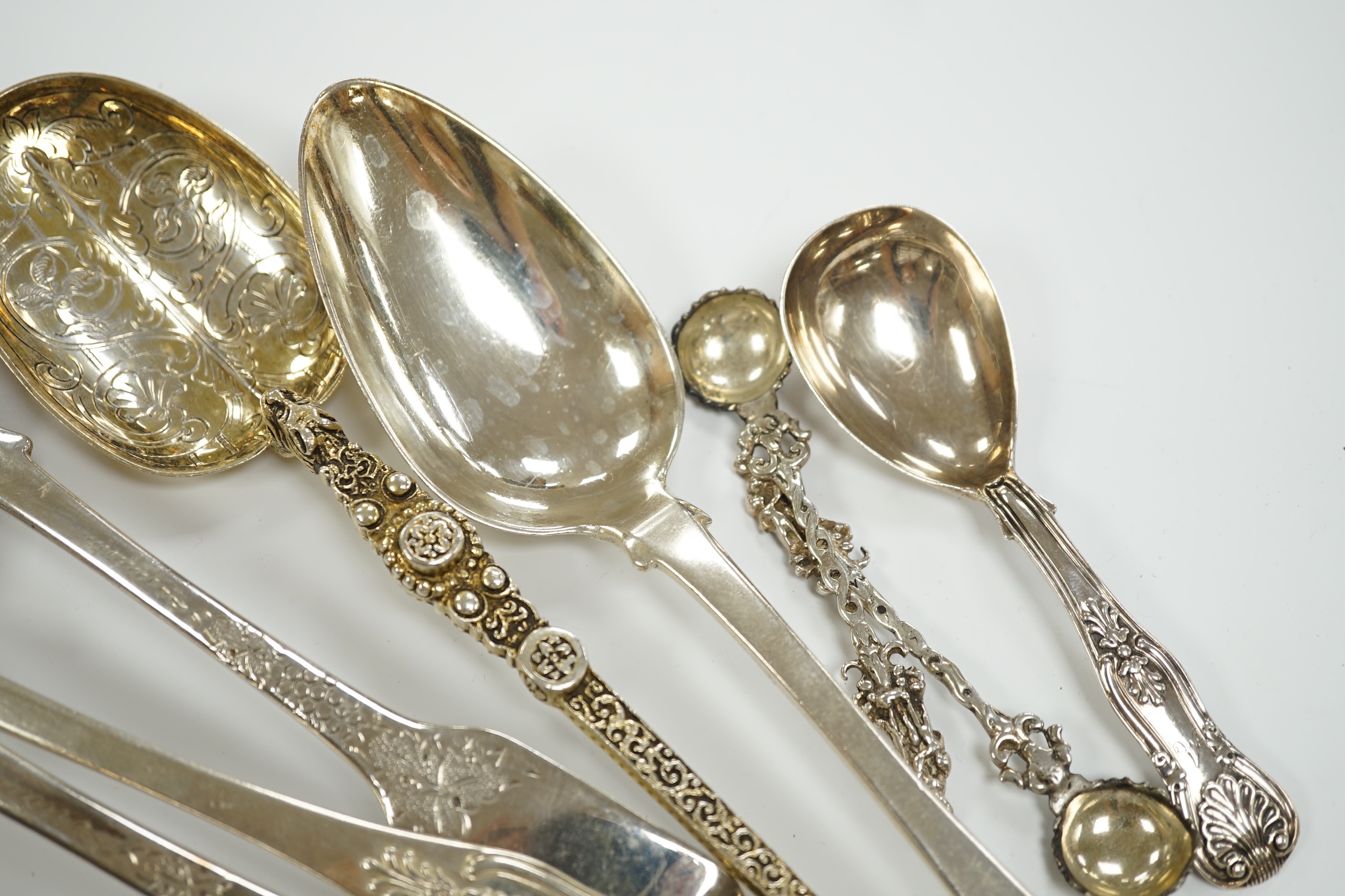 An Edwardian silver 'anointing spoon' Wakeley & Wheeler, London, 1901, 25.5cm, eight other silver spoons including two 19th century caddy spoons and a silver christening mug, 17.7oz.